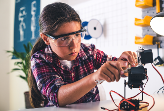 Student with robotics kit